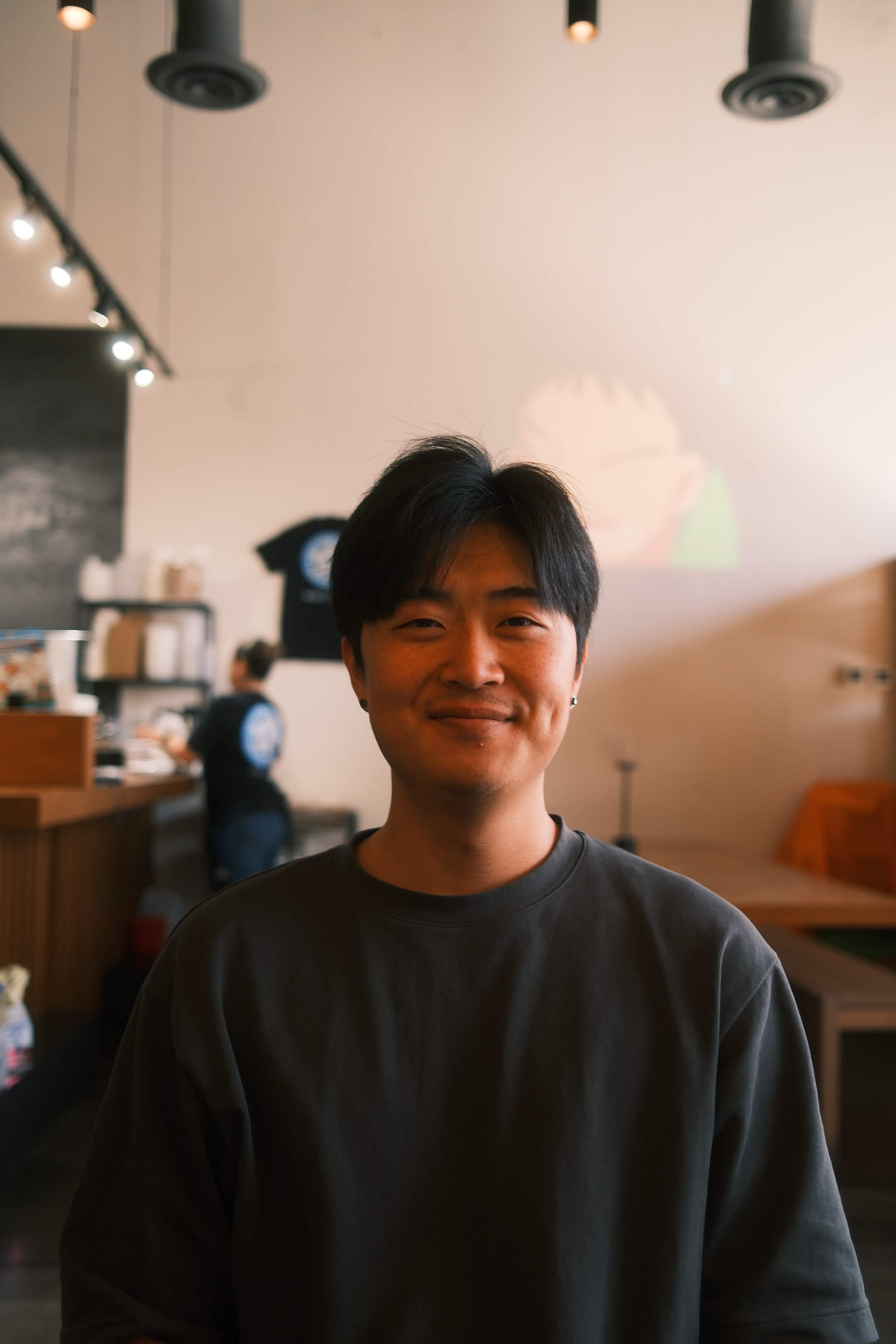 Andy smiling at a café
